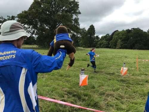 Team mascot, Albert cheers Emma in!