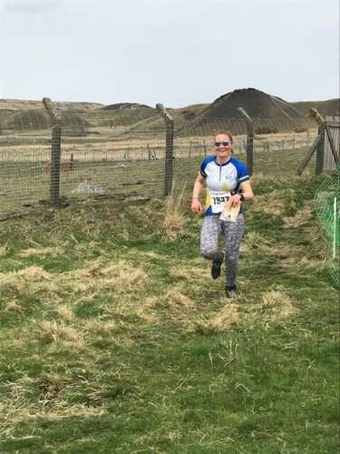 Running into the finish at Pwll Du in Wales